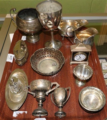 Lot 405 - A group of silver items to include a George III style cream jug; small inkstand; bedside timepiece