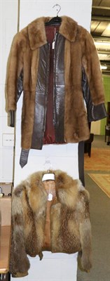 Lot 1040 - Fox fur short jacket retailed by Gladys Whitakers Ltd, trimmed in suede; together with a brown...