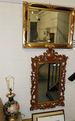 Lot 1049 - Two reproduction mirrors, one carved, one gilt together with a table lamp (3)