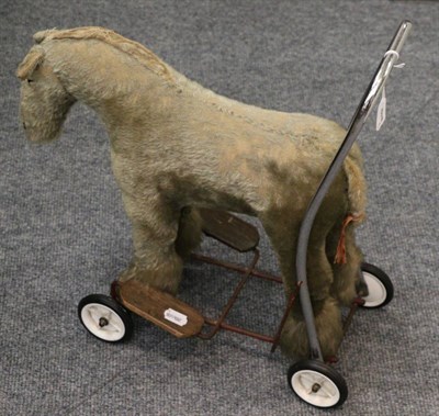 Lot 1068 - Toy horse on wheels