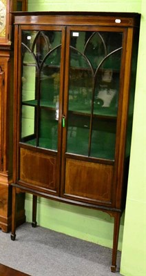 Lot 1120 - An inlaid mahogany display cabinet