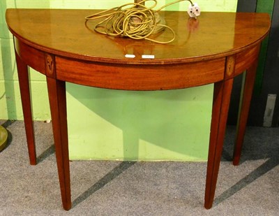 Lot 1127 - A 19th century demi lune side table, on square tapering supports, with decorative inlay