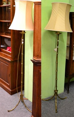 Lot 1135 - Pair of brass faux bamboo standard lamps with silk shades