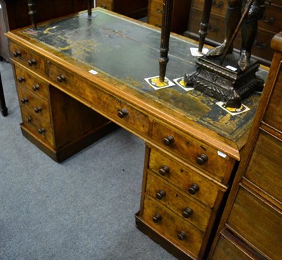 Lot 1147 - A Victorian walnut twin pedestal desk