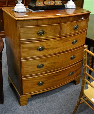 Lot 1166 - An early 19th century mahogany bow front chest of drawers