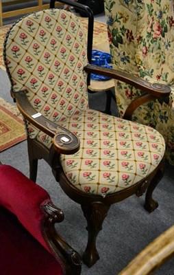 Lot 1168 - A 19th century oak armchair with shell carved legs on ball and claw feet