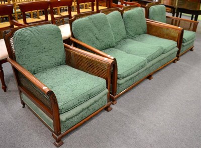 Lot 1174 - An Edwardian mahogany framed three piece Bergere suite