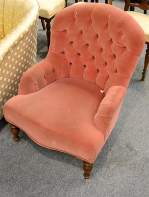 Lot 1176 - A pink button back nursing chair