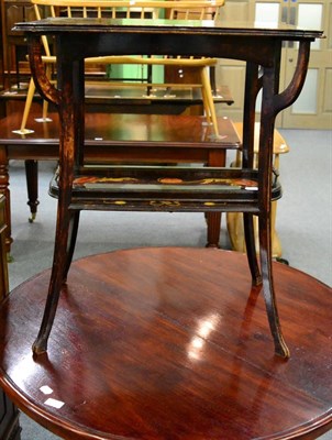 Lot 1187 - An Art Nouveau occasional table with twin handled tray en-suite, with painted floral decoration