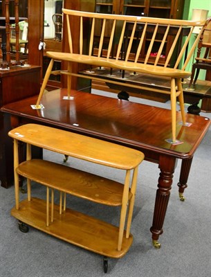 Lot 1199 - An Ercol light elm love seat together with a similar open bookcase