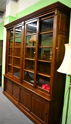 Lot 1212 - A large 20th century oak bookcase