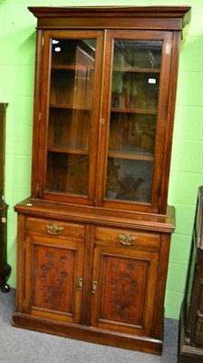 Lot 1213 - A glass fronted bookcase