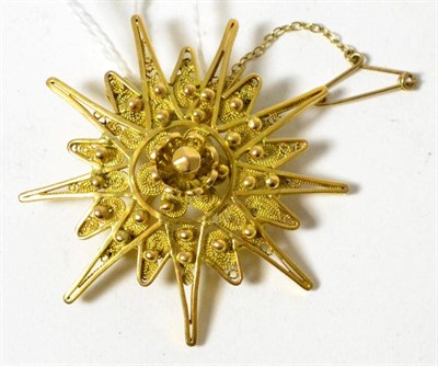 Lot 39 - An 18ct gold filigree star brooch