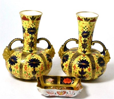 Lot 67 - A pair of Royal Crown Derby vases with mask handles and a Royal Crown Derby pin dish