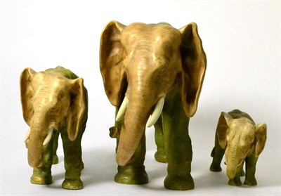 Lot 80 - A graduated set of three Royal Dux style elephants