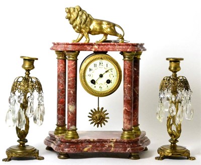 Lot 84 - Red marble portico striking mantel clock and a pair of lustres