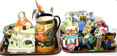 Lot 93 - Two trays of decorative ceramics including a Royal Doulton jug, Toby jug, Beswick,...