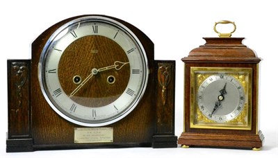 Lot 97 - An oak veneered mantel clock with presentation plaque; and a small Elliot timepiece (2)