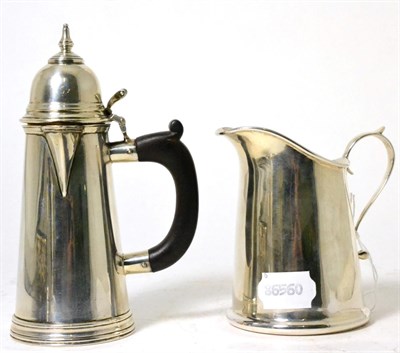 Lot 106 - A small Queen Anne style silver hot water jug, Chester 1913; and a silver cream jug, John...