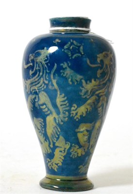 Lot 110 - A blue lustre glazed vase decorated with lions rampant and white roses, stamped E.S.K....