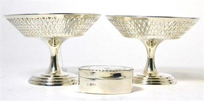 Lot 111 - Silver comprising a pair of Asprey pedestal dishes, Birmingham and an engraved oval box,...