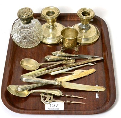 Lot 127 - A pair of silver squat candlesticks, a silver mounted scent bottle, silver cutlery, etc