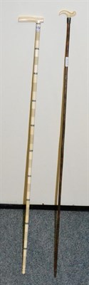 Lot 156 - An ivory walking cane, late 19th century, in two sections, together with a small silver mounted and