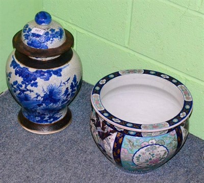 Lot 167 - A Japanese porcelain cache pot and a Chinese blue and white covered jar