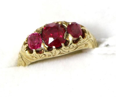 Lot 228 - A Victorian three stone ruby ring