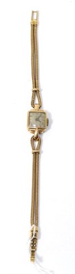 Lot 229 - An 18ct gold lady's Invicta watch