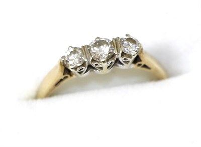 Lot 234 - A 9ct gold three stone diamond ring