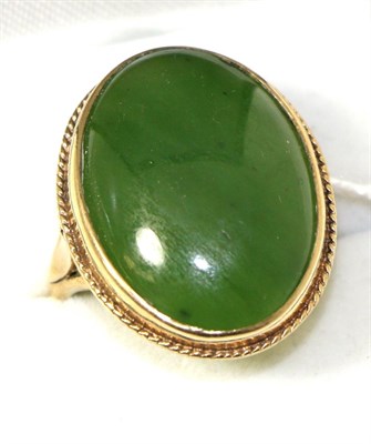 Lot 235 - A nephrite ring, finger size U