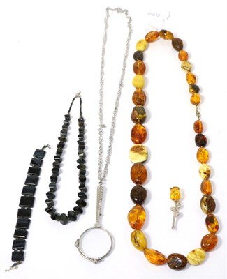 Lot 241 - An amber necklace, a hardstone necklace and bracelet set, a lorgnette and a brooch