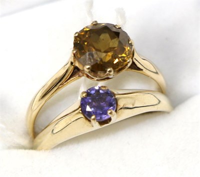 Lot 242 - A 9ct gold citrine ring and a 9ct gold tanzanite ring