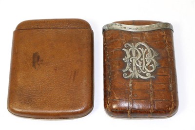 Lot 248 - A silver mounted leather cigar case, with monogram; and a leather cigar case, inscribed with...