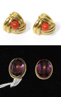 Lot 261 - A pair of amethyst ear stud earrings, stamped '750' and a pair of coral stud earrings, stamped...