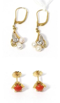 Lot 262 - A pair of cultured pearl drop earrings, stamped '750' and a pair of coral stud earrings