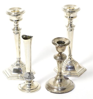 Lot 273 - A pair of modern silver candlesticks on octagonal bases, another single example and a posy vase (4)