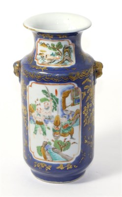 Lot 279 - A Chinese blue ground vase with gilt decoration and reserves painted with fighting figures