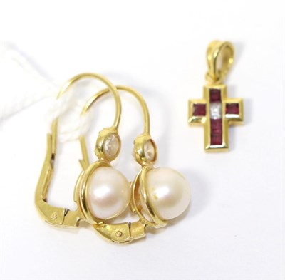 Lot 299 - A pair of cultured pearl earrings, stamped '750' and a gem set cross pendant, stamped '750' (2)