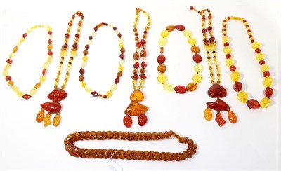 Lot 310 - Eight various amber bead necklaces