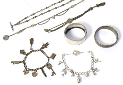 Lot 318 - Two hinge opening bangles, two charm bracelets, two Albertinas and an Albert