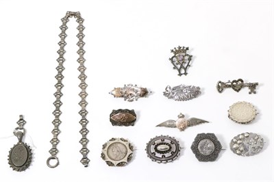 Lot 325 - Eleven Victorian brooches and a locket on chain (af)