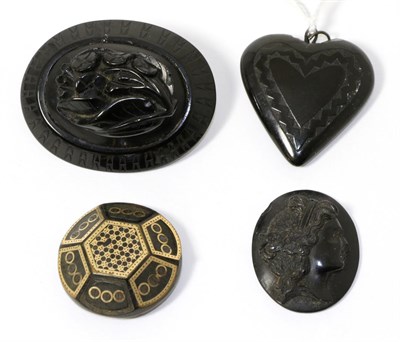 Lot 332 - A jet brooch, a jet heart pendant, a jet cameo and a tortoiseshell pique work brooch (a.f.)