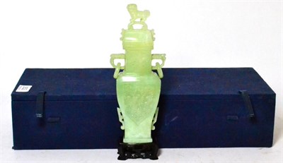 Lot 352 - A jade type vase in archaic style, the lid surmounted by a dog of foe, 23cm high