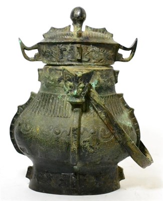 Lot 362 - A bronze huang vessel and cover