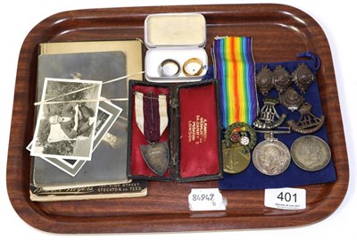 Lot 401 - A First World War medal pair; two 22ct gold wedding bands; an 1821 crown; a silver and enamel...