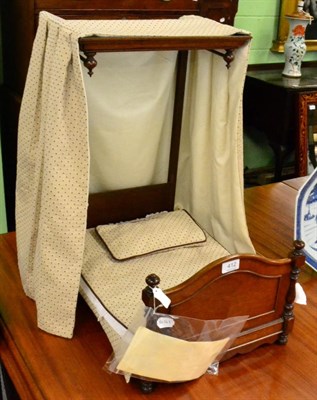 Lot 412 - A Victorian mahogany dolls half tester bed, with turned bed ends, replacement curtain, bed...