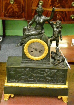 Lot 422 - A French gilt metal striking mantel clock, case depicting a lady in robes with a winged cherub