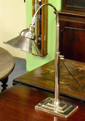 Lot 424 - An adjustable desk lamp, nickel plate